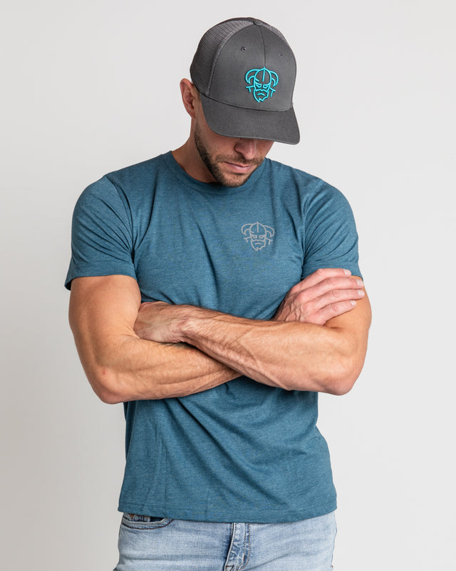 Blue Men's disc golf t-shirt front view showcasing Charcoal snapback disc golf hat with large blue embroidered Odin logo | Odin Disc Golf apparel